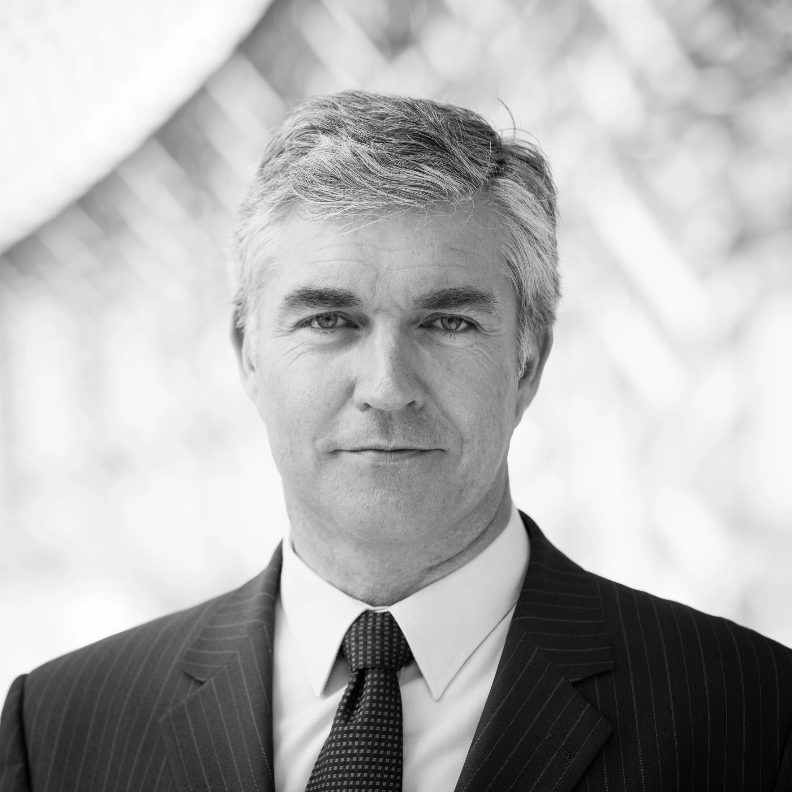 Professional headshot of a business executive